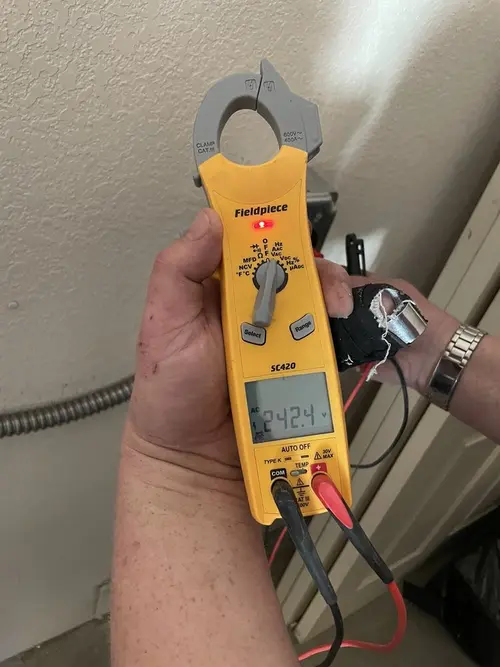 Voltage testing with clamp meter during Whole House Surge Protector in Neptune Beach